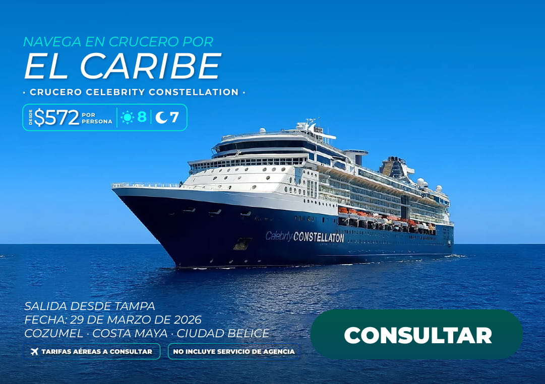 Barco de crucero moderno anclado en aguas cristalinas de una isla caribeña, disponible a través de los planes de viaje de Molina Viajes 2026.