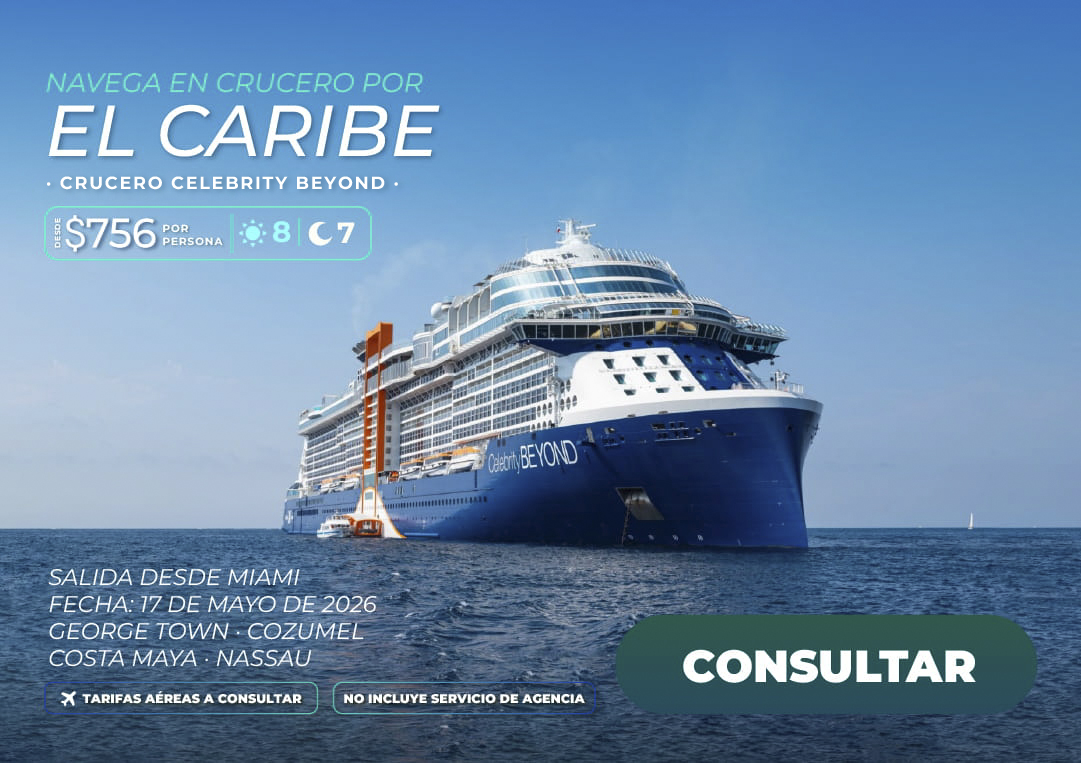 Barco de crucero moderno anclado en aguas cristalinas de una isla caribeña, disponible a través de los planes de viaje de Molina Viajes 2026.